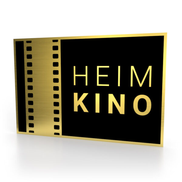 Schild in Schwarz-Gold mit dem Schriftzug "Heimkino" und einem Filmstreifen